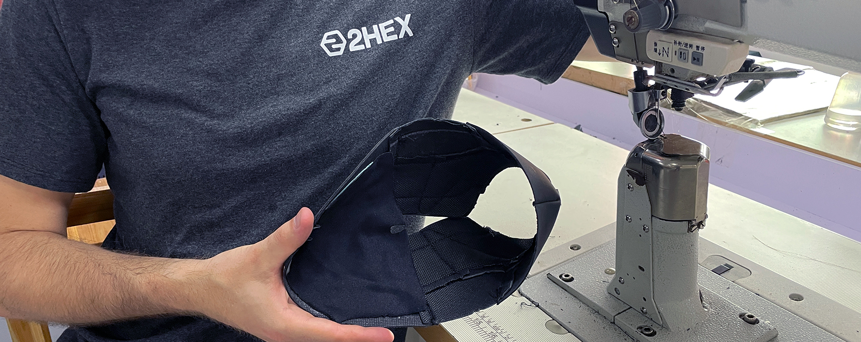 Sewing shoes’ upper inside 2HEX sports shoes factory.