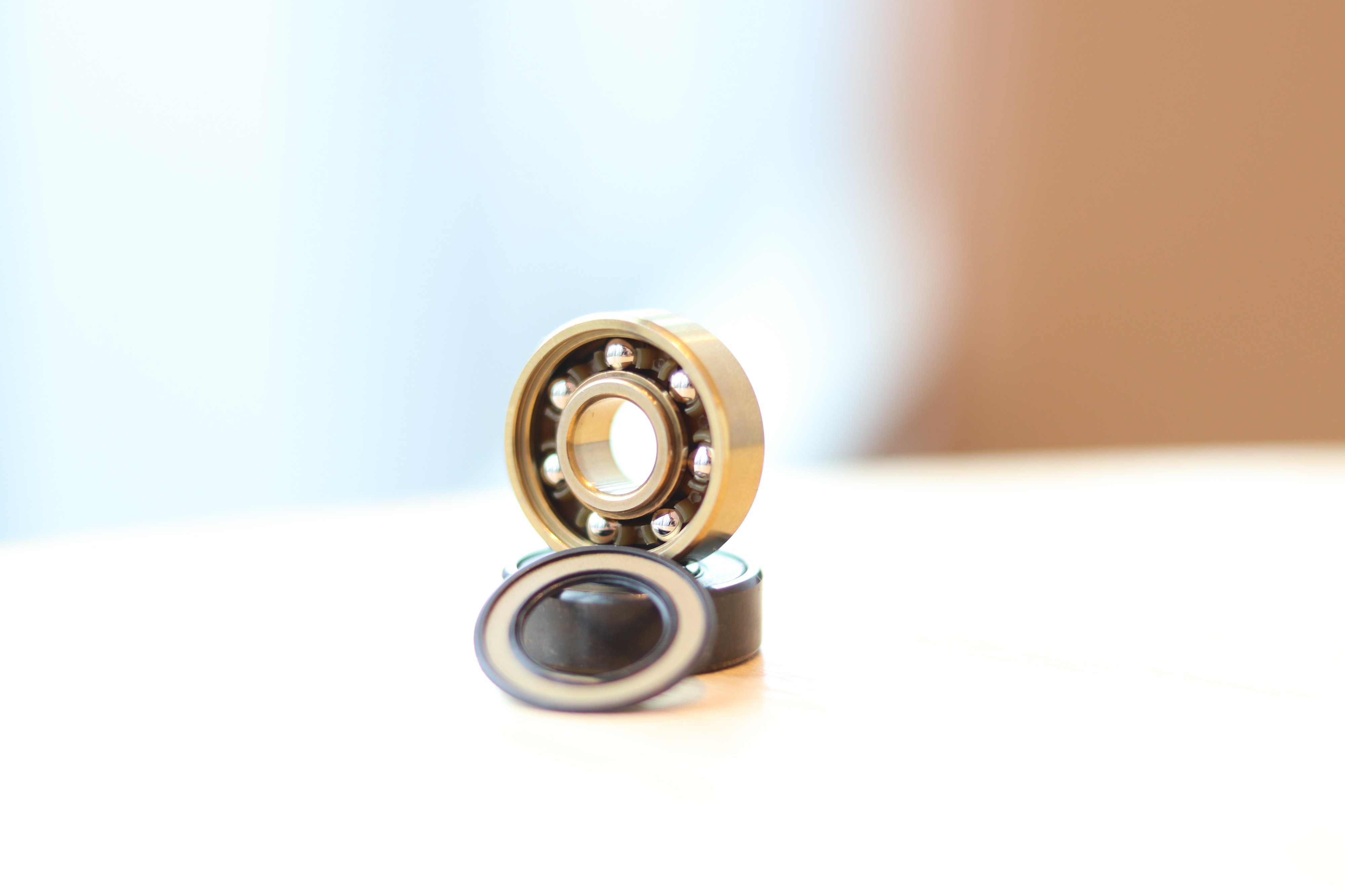 2hex skateboard bearings with open shield golden balls and gold retainer front