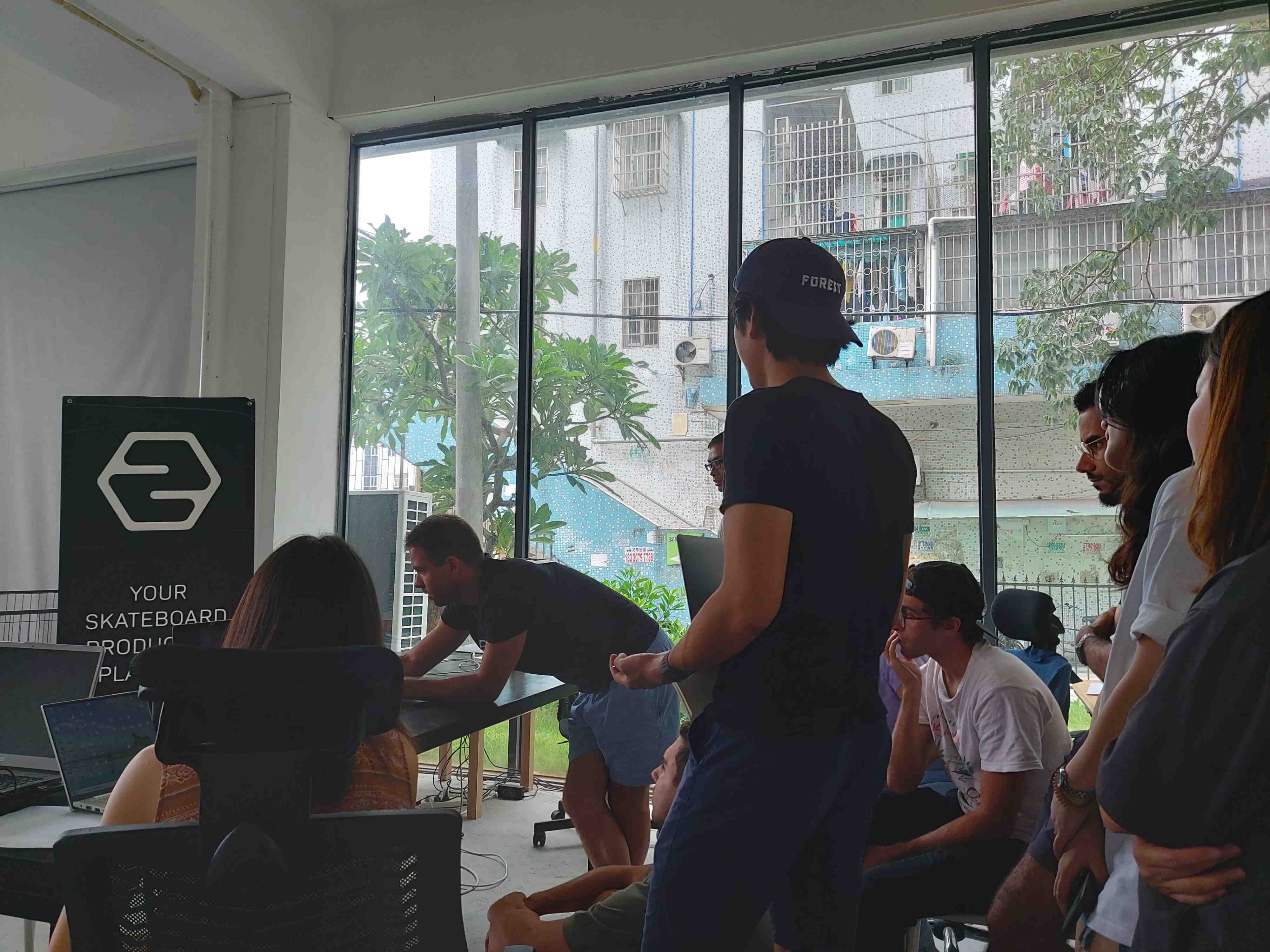 a meeting at the 2hex skateboard manufacturer office