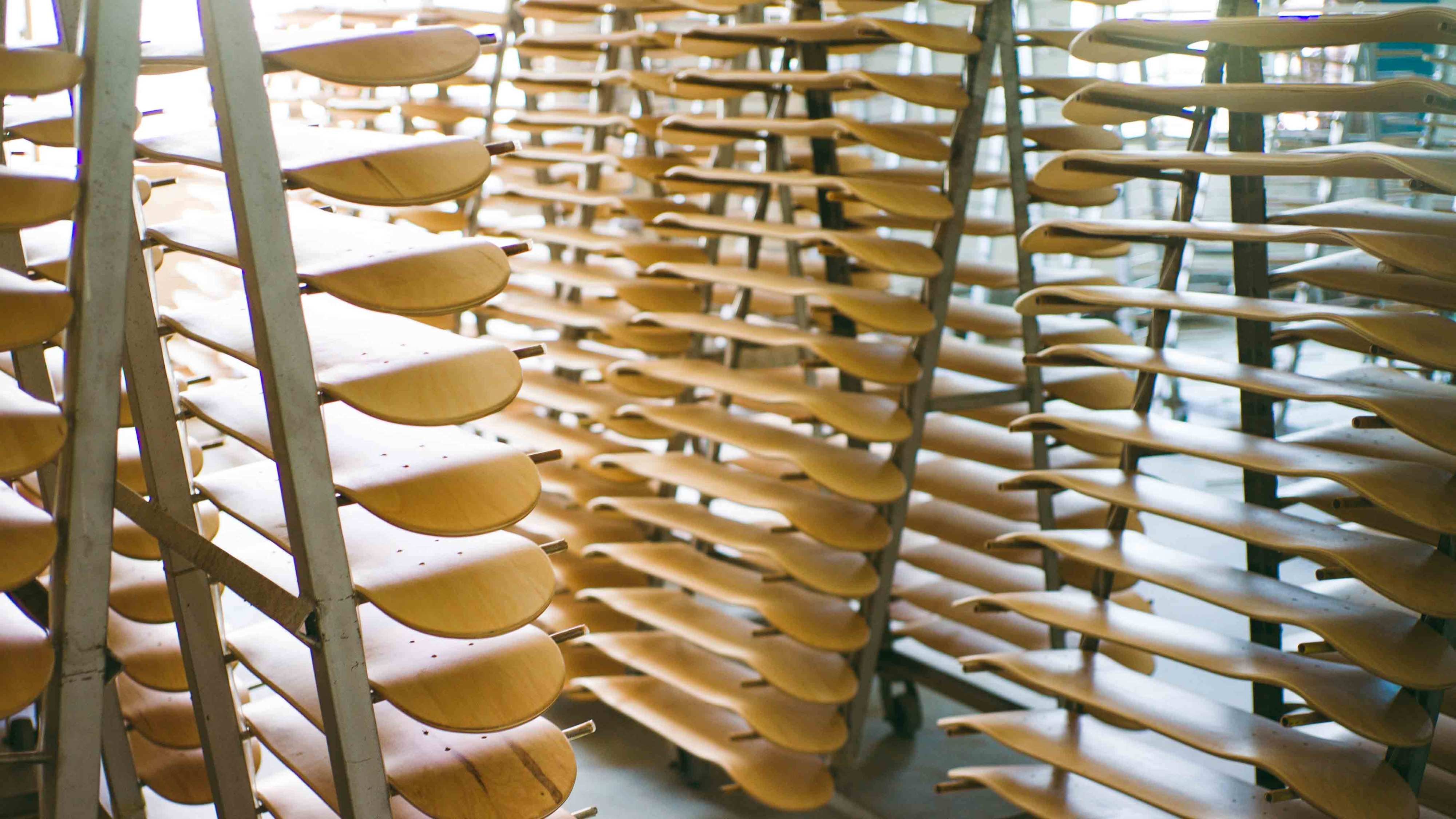 Skateboard decks varnish drying at 2HEX skateboard factory