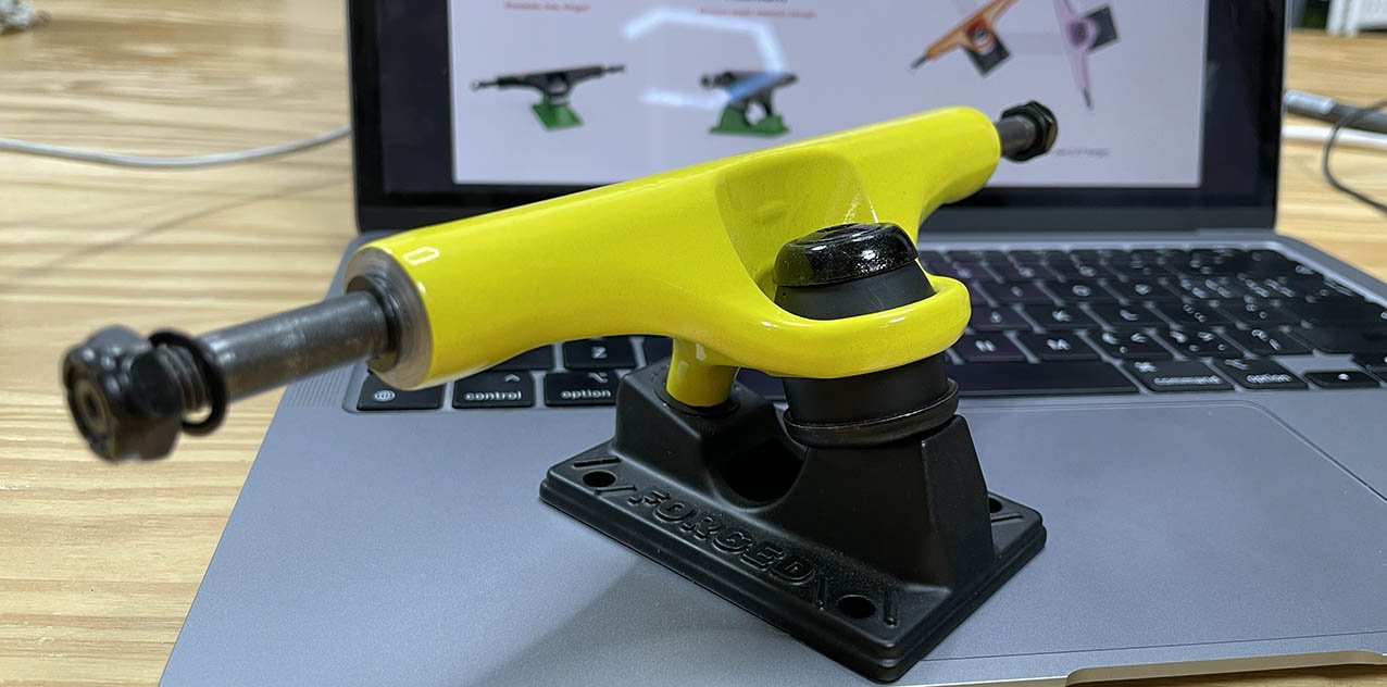yellow lunar light skateboard trucks with inverted kingpin