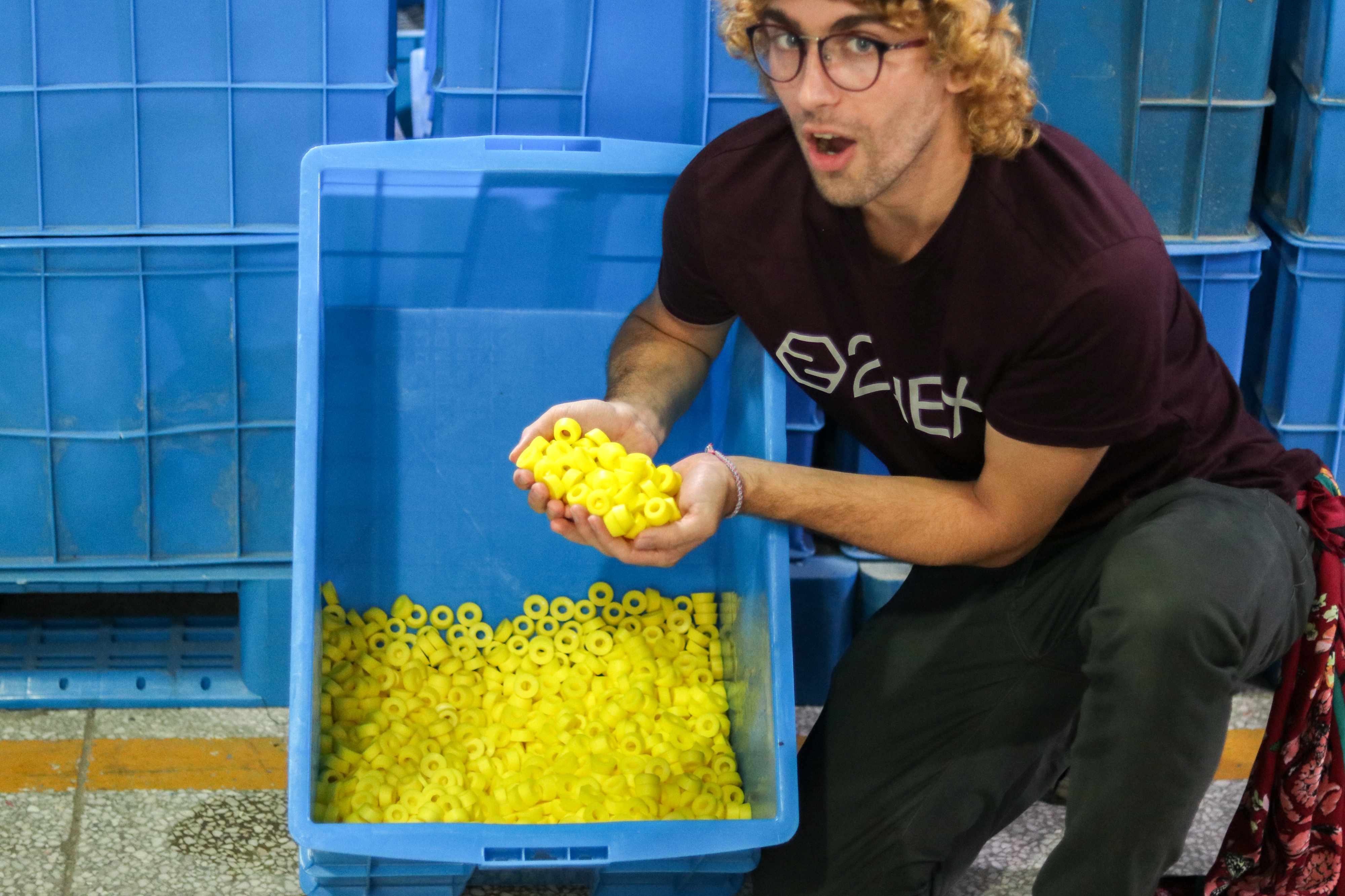 production manager checking out skateboard bushing production
