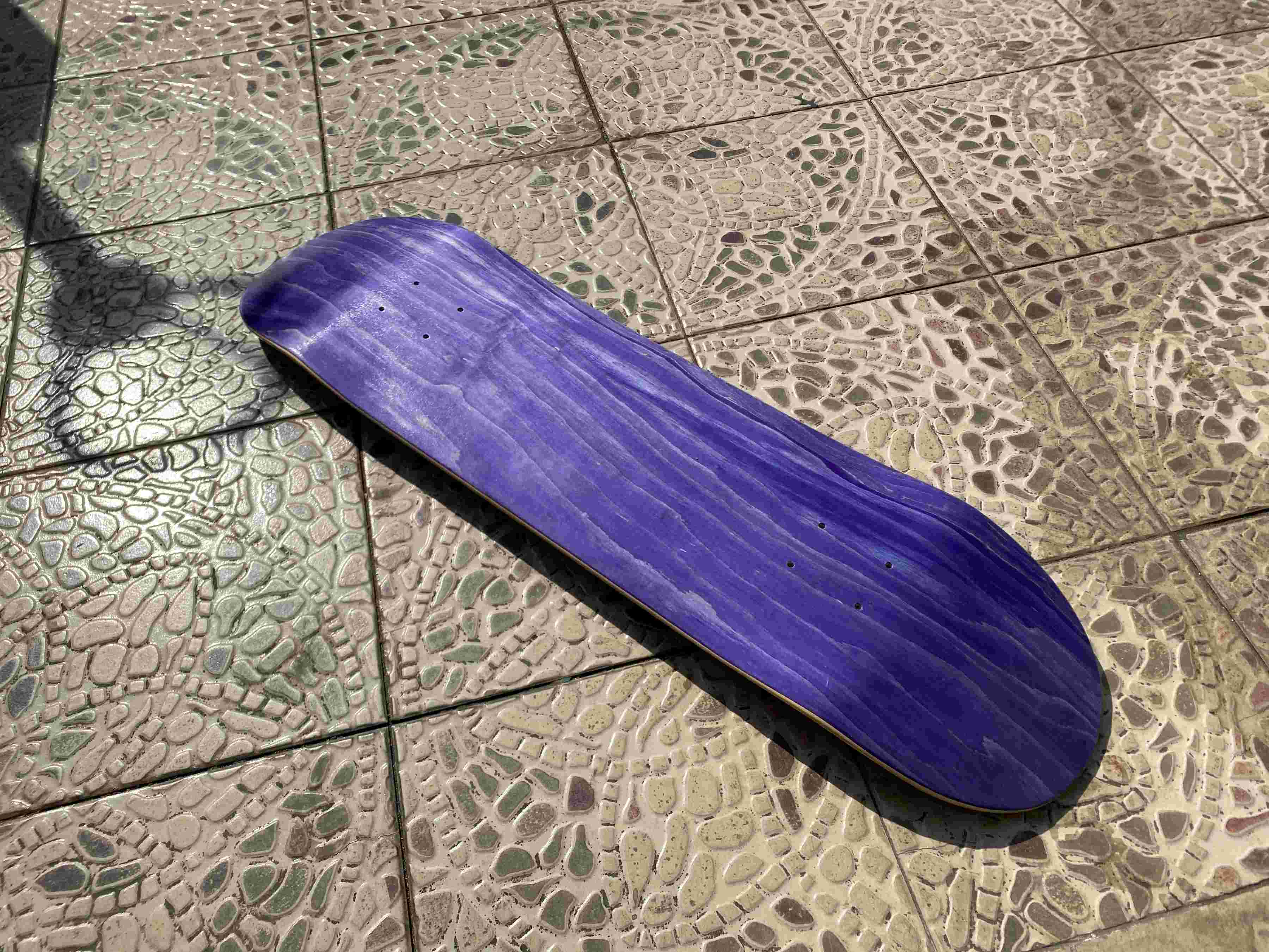 skateboard veneer closeup of a finshed purple deck