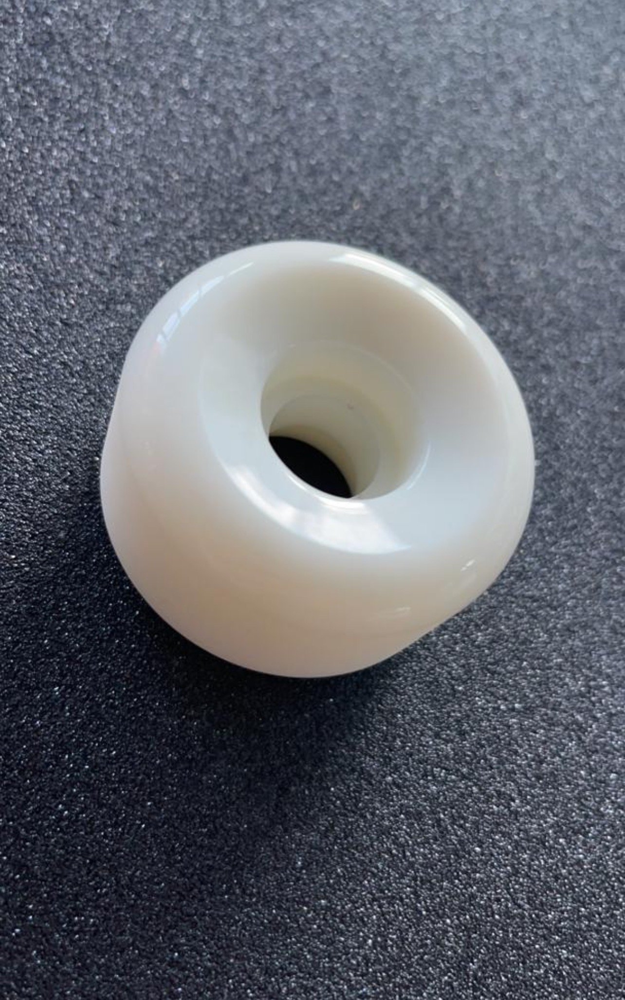 close up of white wheel shape samples for skateboarding