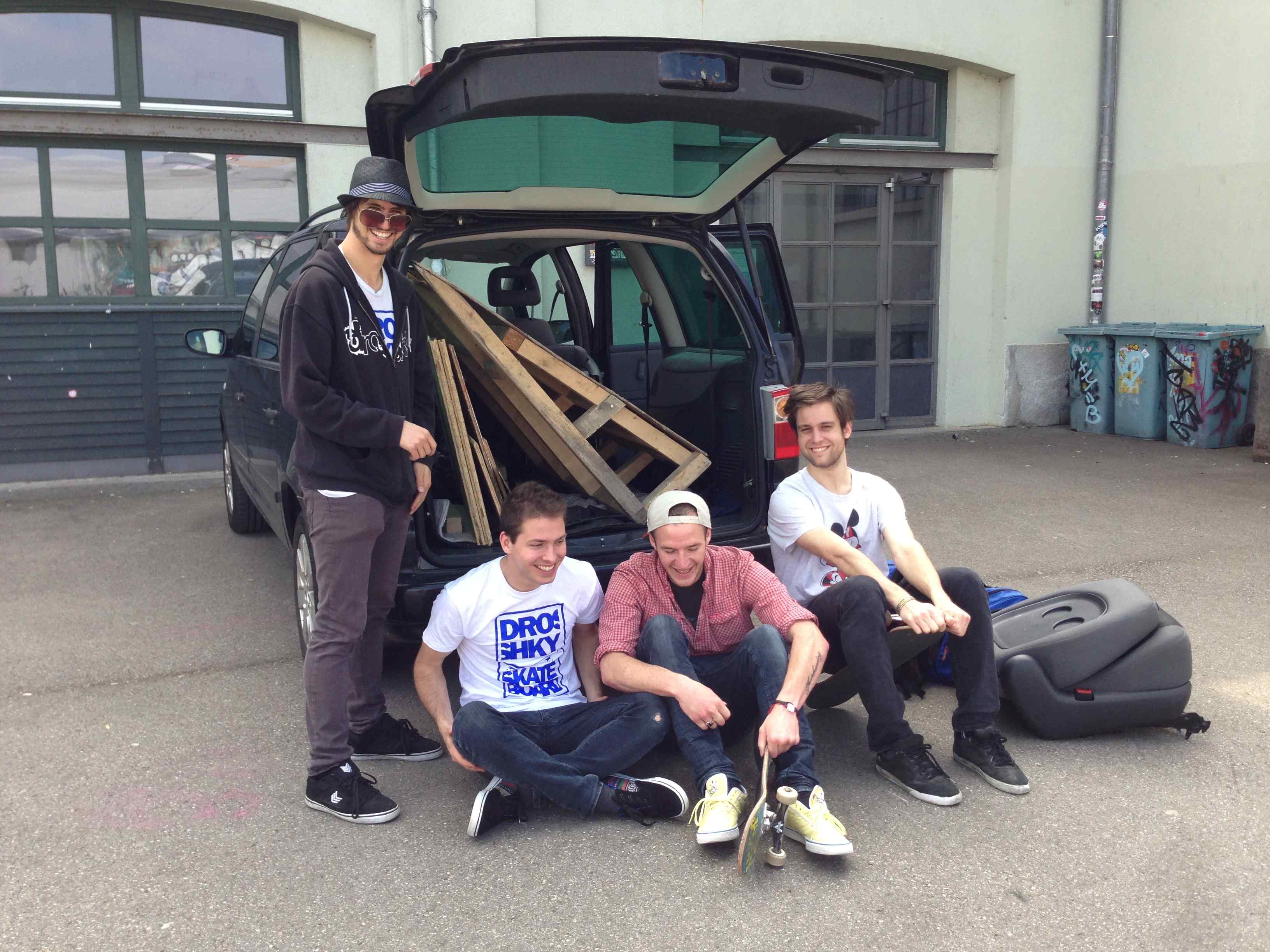 skating parking lot with friends and skateboard ramps