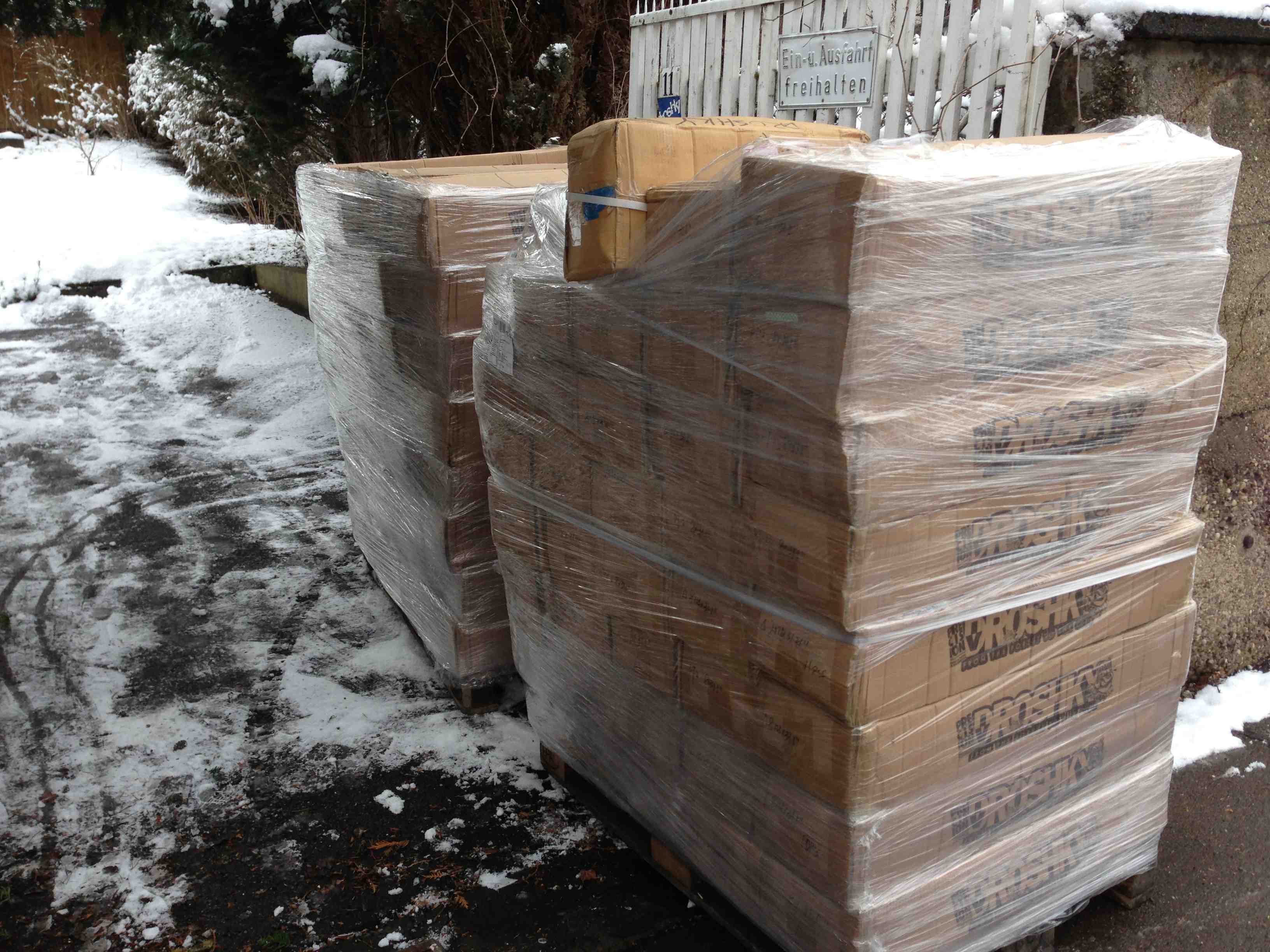 pallets of droshky skateboard decks in the snow