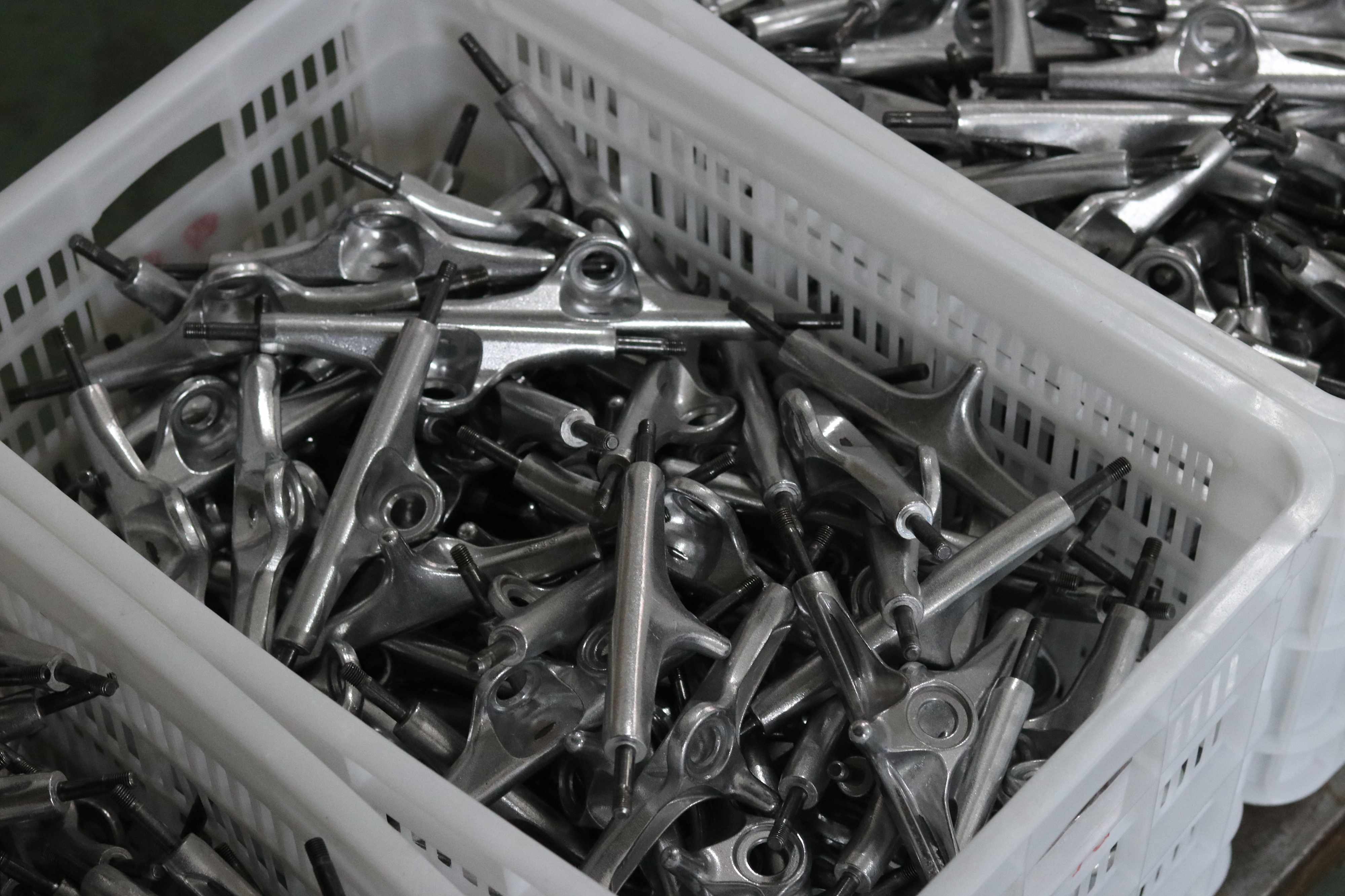 Custom made skateboard truck hanger inside a skateboard factory production