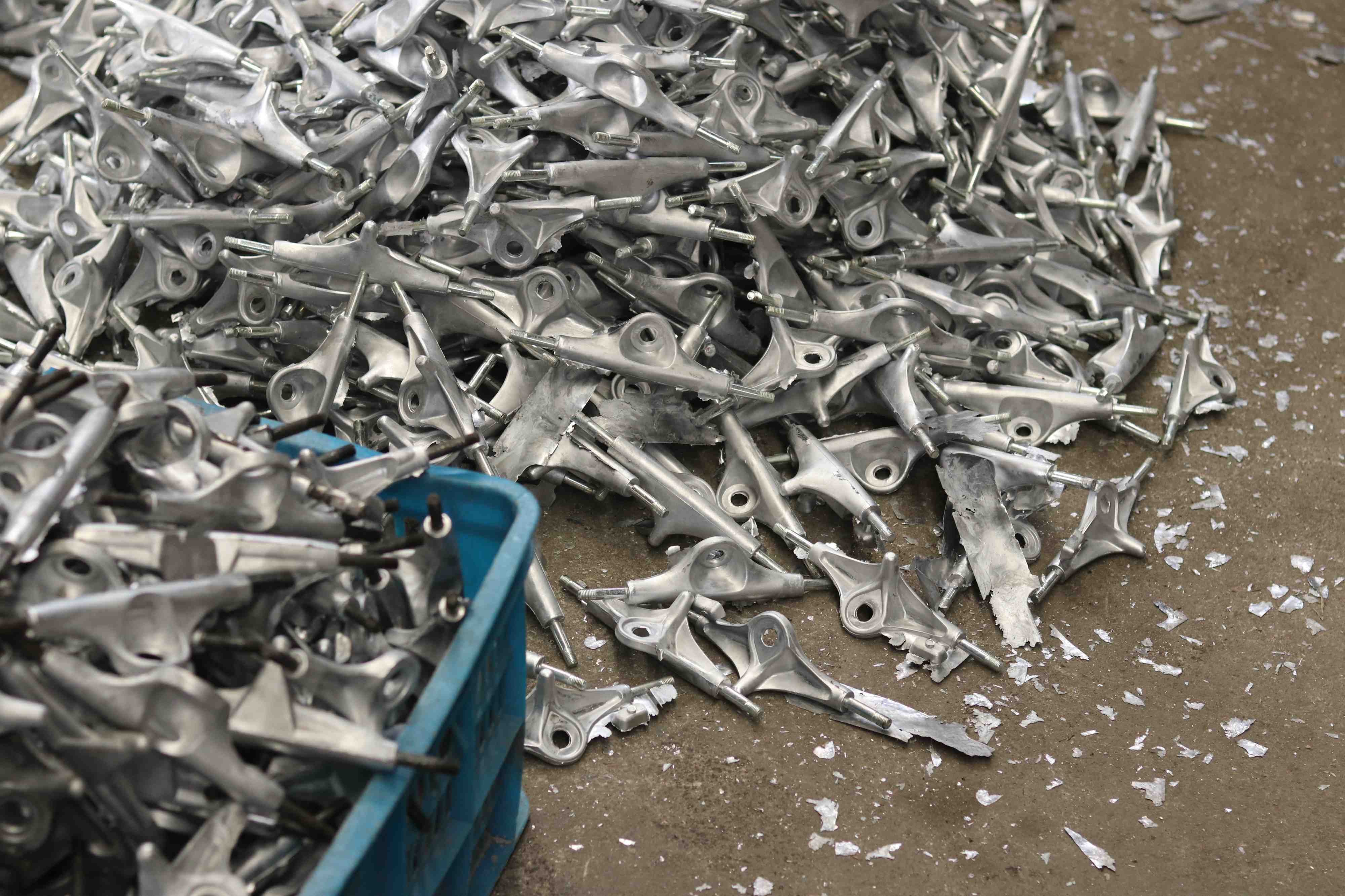 pile of skateboard truck hangers going through production