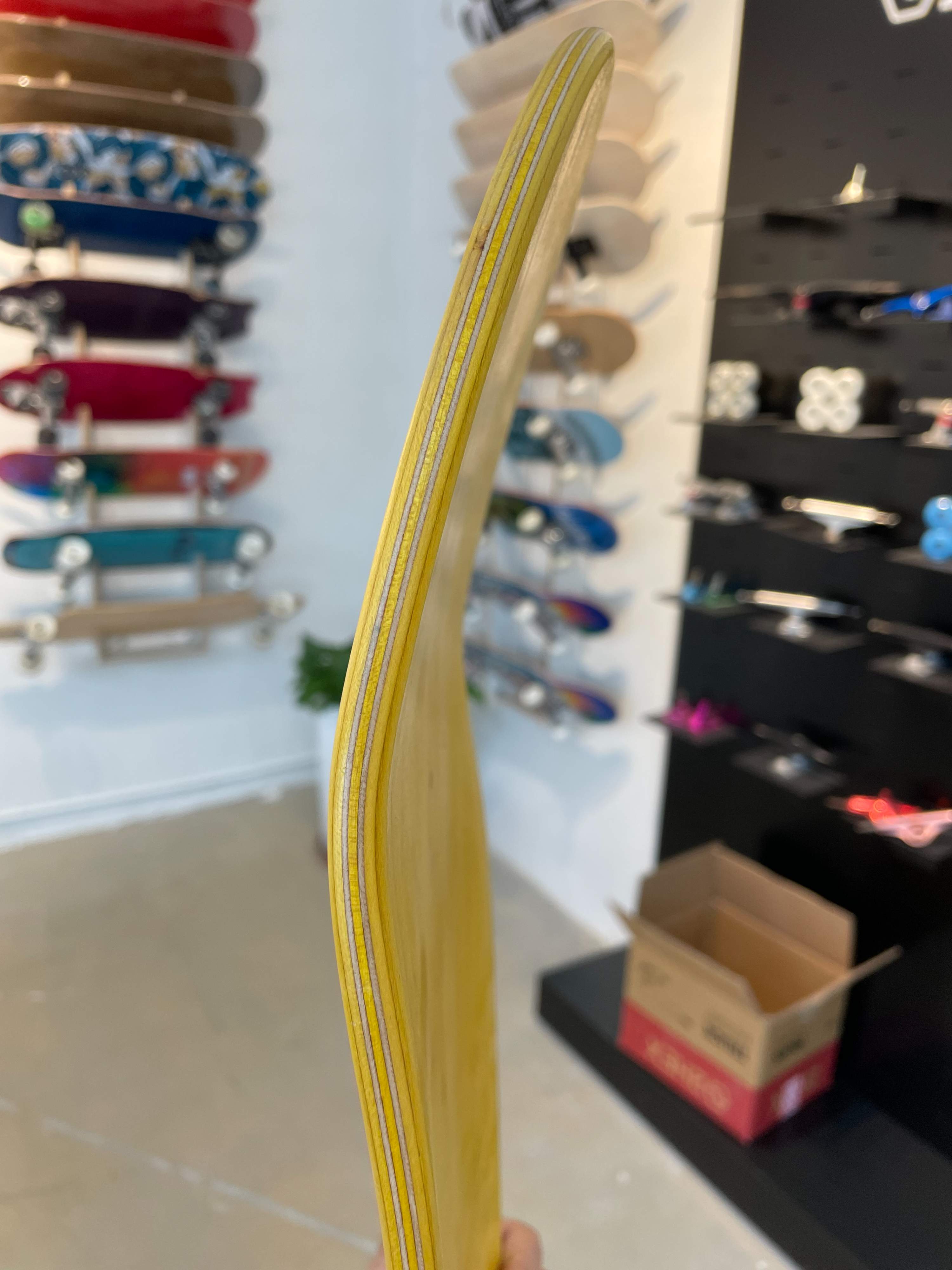 closeup of a 2hex yellow skateboard deck veneers