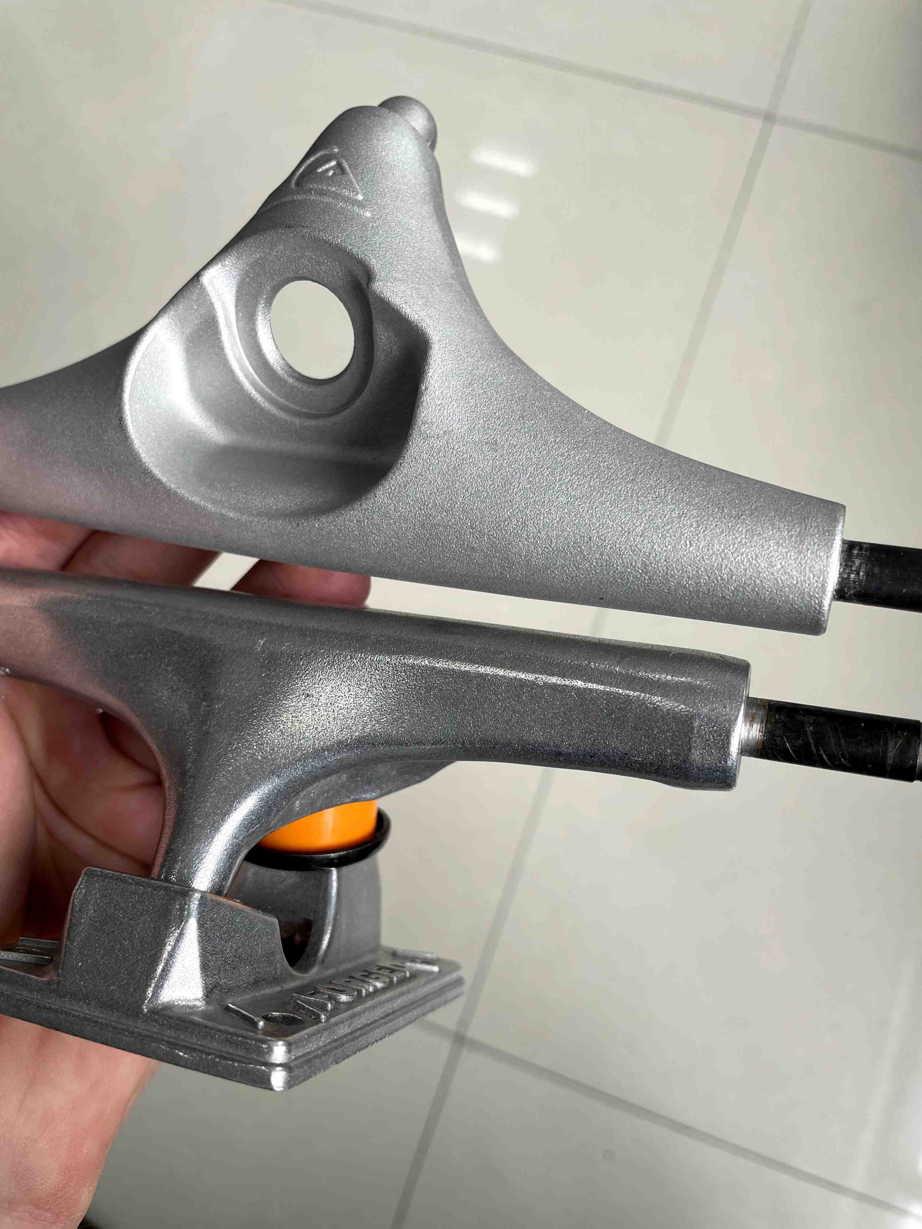 checking the difference between finishes of surf skate trucks