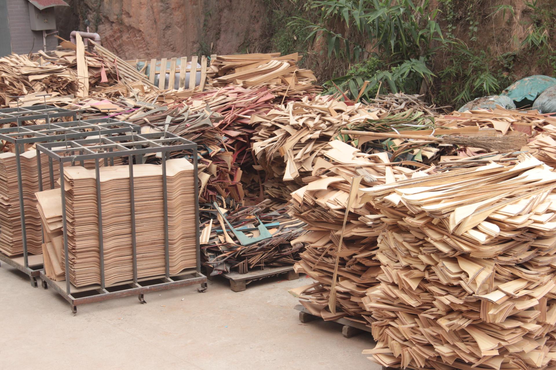 scrap pieces of wood outside waiting to be recycled